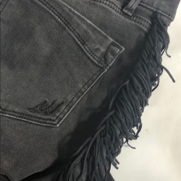 black jeans with fringe on the side